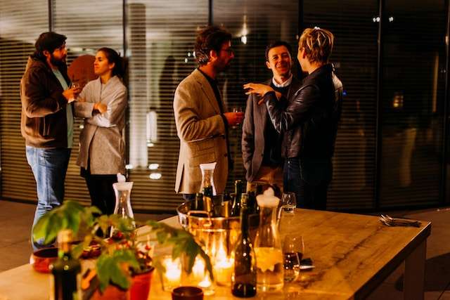 A group of professionals chatting, symbolic of networking opportunities in San Diego.
